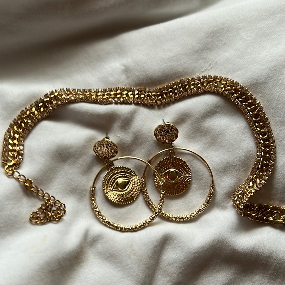 Costume jewelry gold choker necklace with earrings.